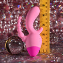 Selopa Game On Triple Stimulation Vibrator Pink positioned with a ruler for size comparison on a sparkling background.