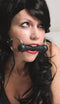 Woman wearing Spartacus Leathers Silicone Bit Gag, featuring silicone bit and leather strap for comfort.