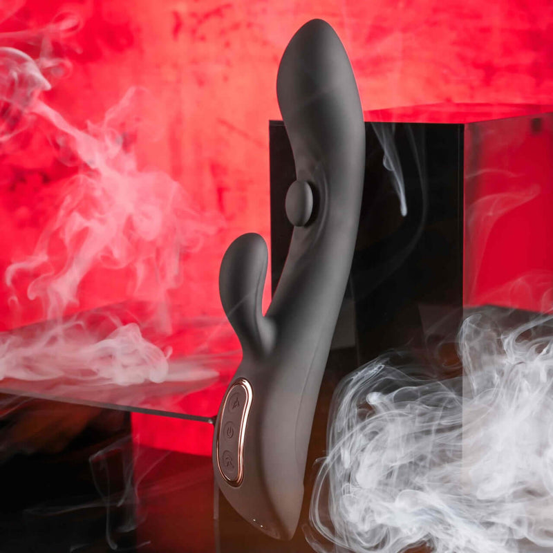 Playboy That's The Spot - Dual G-Spot Vibrator with 10 Speeds on display with red smoky background