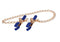 Cougar chained nipple clamps with gold chain and blue tips for adjustable pressure in BDSM play.