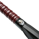 Close-up of the handle of the Sex & Mischief Mahogany Flogger, showcasing its elegant design and quality materials.
