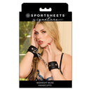 Sportsheets Signature Midnight Muse Handcuffs displayed with a model showcasing their luxurious design and comfort.