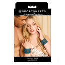 Sportsheets Signature Twilight Tease Handcuffs displayed in packaging with model demonstrating use.