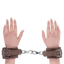 Sportsheets Signature Dawn Dream Handcuffs showcasing stylish silicone cuffs and silver hardware on hands.