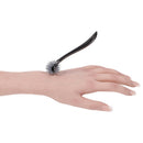 Sportsheets Signature Wartenberg Wheel on a hand, showcasing the precision rolling wheels for sensation play.