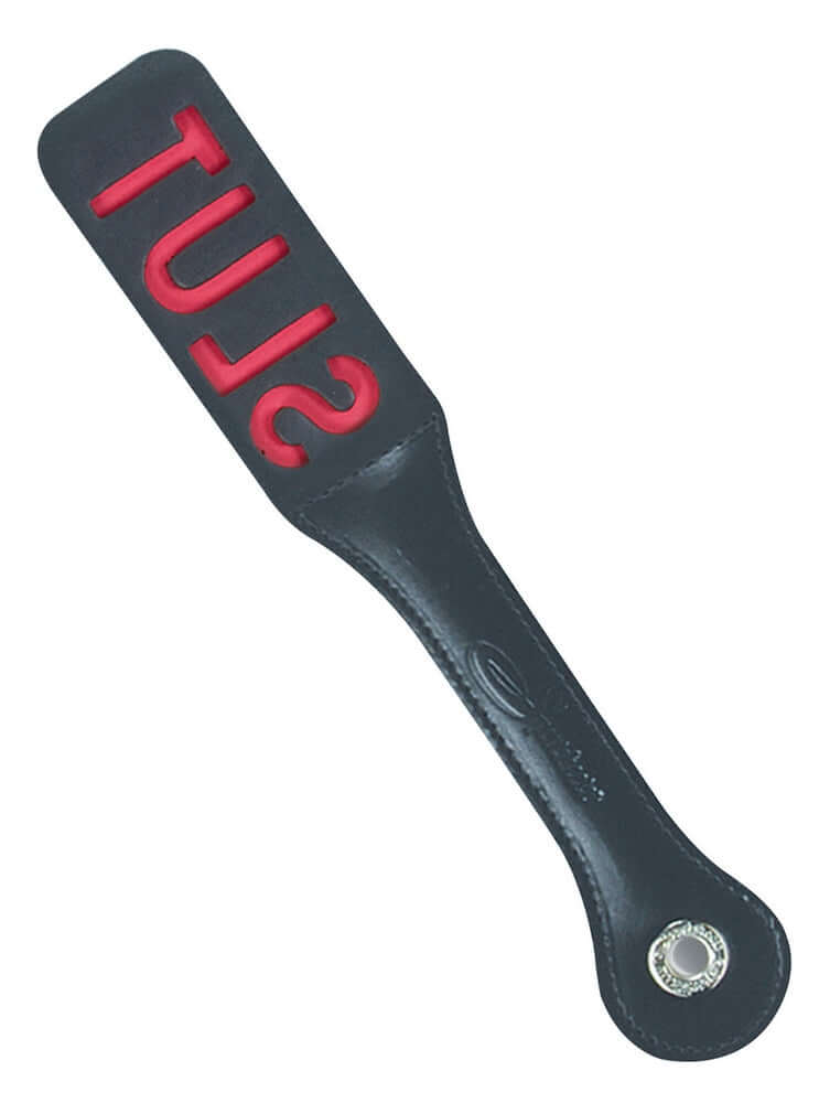 Black leather paddle with red 'SLUT' cut-out, measuring 12 inches, designed for creating impressions and unique sounds.