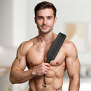 Strict Leather Black Fraternity Paddle held by a muscular man, showcasing its sleek design for impact play.