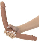 Silicone Studs Bend & Hold Dual Dildo 16 inch Brown held in hand, showcasing its flexible design and dual-ended functionality.
