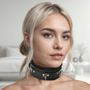 Close-up of a model wearing a Strict Leather Fur Lined Locking Collar Small Medium Black indoors.