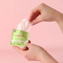 Sweetums Watermelon Flavored Intimate Wipes being pulled from packaging, showcasing freshness and convenience.