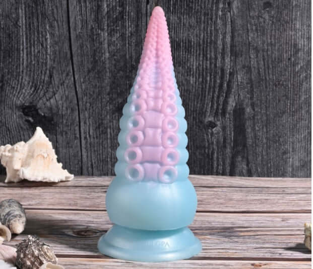 Selopa Stuck on You rechargeable silicone dildo in pink and blue, featuring flexible tentacle design and suction cup base.