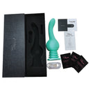 Tracy's Dog Trat Ejaculating Dildo Vibrator Teal in packaging with accessories and instruction manual.