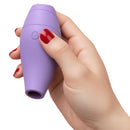 Tracy's Dog Pockiss Clitoral Suction Vibrator Purple held in hand with deep purple hue.