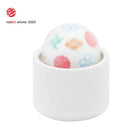 Tenga Iroha Temari KAZE compact massager with floral design, Red Dot winner 2020, showcasing ergonomic design.