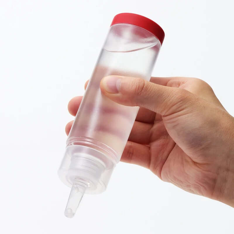 TENGA Hole Lotion Regular 5.75 oz bottle with new one-way valve for leak prevention, held in hand