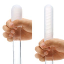 Hand holding a Pocket Tenga Wave Line Masturbation Sleeve, showcasing its wave-designed tip and sleek, discreet form.
