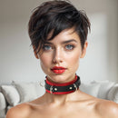 Strict Leather Deluxe Red and Black Locking Collar styled for bondage, featuring a sleek design and silver hardware.