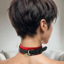 Strict Leather Deluxe Red and Black Locking Collar showcased on a model, featuring bold colors and practical locking hardware.