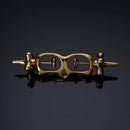 UPKO Thumb Metal Cuffs in gold, featuring a unique string mechanism for secure and discreet restraint play.