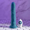 Evolved Tsunami realistic vibrator with remote control on white tile surface
