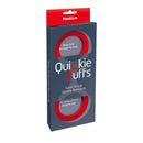 Quickie Silicone Cuffs Medium Red packaging featuring super strong silicone restraints for discreet bondage play.