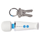 Magic Wand Micro Rechargeable Wand Massager next to keys, showcasing its compact size and portability.