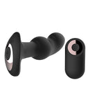 Gender Fluid Frission Anal Vibe with Remote Black alongside its remote control, designed for hands-free stimulation.