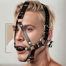 Strict Leather Ball Gag Harness Black worn by a model, showcasing its secure design and polished look.