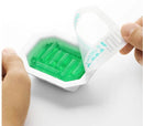 Person revealing Tenga Uni Variety Pack pleasure sleeves with green texture design.
