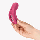 Fun Factory Laya III Lay-on Vibrator Magenta held in hand, showcasing its ergonomic design and stimulation features.