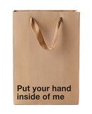 Wood Rocket Put Your Hand Inside Me Gift Bag made of Kraft paper with playful text for unique gift-giving.