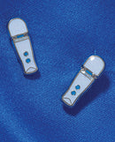 Wood Rocket Magic Wand Micro Earrings on blue fabric with glitzy finish, cute playful design for fun occasions.
