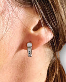 Wood Rocket Magic Wand Micro Earrings worn on ear, showcasing playful design and cheeky style.