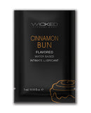 Wicked Sensual Care Aqua Water Based Lubricant Cinnamon Bun flavored intimate lubricant sachet packaging.