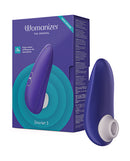Womanizer Starlet 3 Air Suction Stimulator Indigo packaging and product displayed on a colorful background.