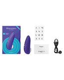 Womanizer Starlet 3 Air Suction Stimulator Indigo with packaging and accessories displayed.
