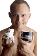 Master Series Invade Deep Fisting Cream 8 Oz held by a smiling man with whipped cream in one hand.