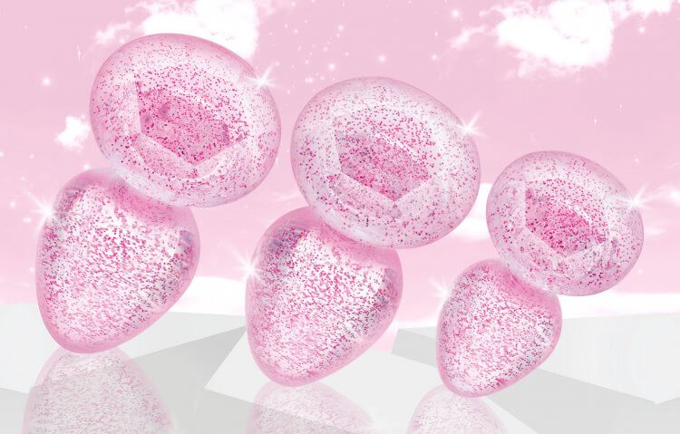 Booty Sparks Glitter Gem Anal Plug Set in pink, featuring smooth, tapered designs in varying sizes with sparkling glitter.