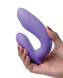 Inmi 10x G-Tap Tapping Silicone G Spot Vibrator Purple held in hand, showcasing its ergonomic design and vibrant color.
