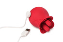 Bloomgasm The Rose Fondle Rose Clit Stimulator in red with USB charging cable.