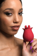 A model showcasing Bloomgasm The Rose Fondle Rose Clit Stimulator, a rose-shaped clitoral stimulator.