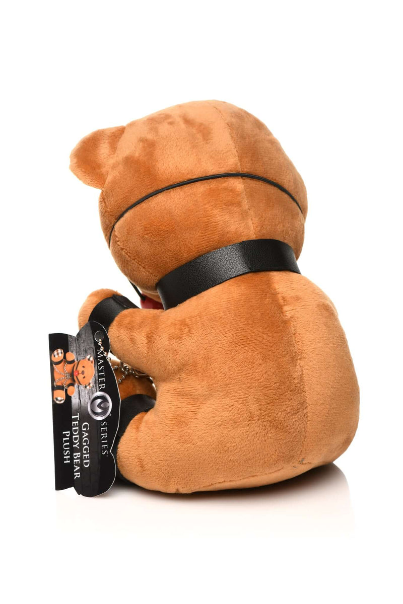 Gagged Bondage Bear plush toy with collar and cuffs, from Master Series by XR Brands, perfect for gag gifts or playful cuddling.