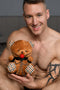 Smiling man holding Master Series Gagged Bondage Bear, featuring collar and cuffs, perfect for gifting or personal collection.