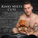 Master Series Gagged Bondage Bear with chains, cuffs, and ball gag, held by a man against a dark background.