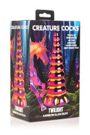 Creature Cocks Twilight Rainbow Glass Dildo packaging with unicorn horn design in pink and yellow gold hues.