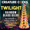 Creature Cocks Twilight Rainbow Glass Dildo with iridescent design in pink and yellow gold, set against a mystical forest backdrop.