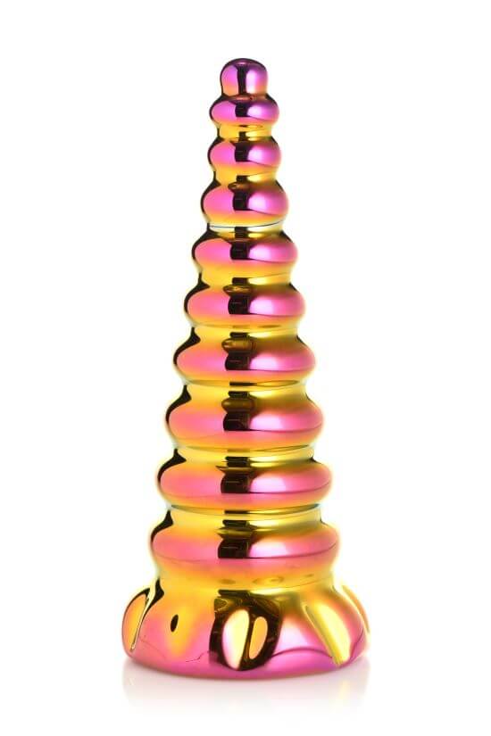 Iridescent pink and yellow gold unicorn horn-shaped glass dildo with a smooth, ribbed texture.