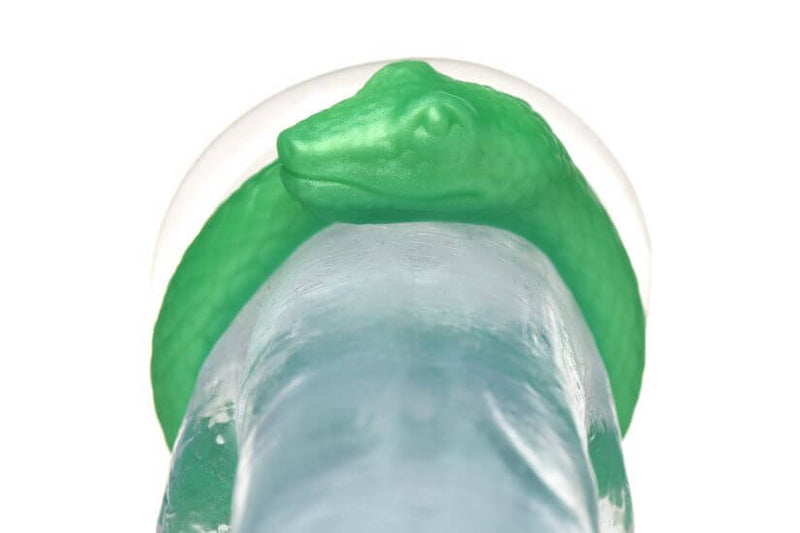 Close-up of Creature Cocks Serpentine Cock Ring in Jade Green Snake Design wrapping around clear shaft.