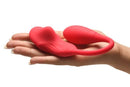 Frisky Double Love Connection Panty Vibe with Remote Control held in hand, showcasing its discreet design and powerful stimulation.