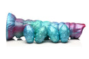 Fantasy ovipositor silicone dildo in iridescent teal, red, and blue colors for sci-fi pleasure and role-play.
